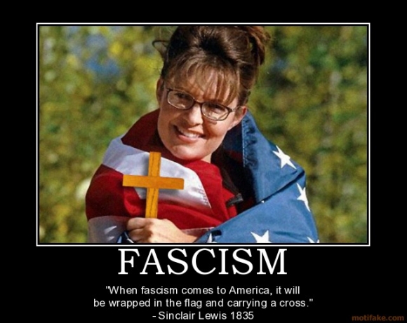 A picture of Sarah Palin wrapped in a US flag and holding a cross while smiling. The caption says "Fascism. When fascism comes to America, it will be wrapped in the flag and carrying a cross. - Quote attributed to Sinclair Lewis, 1835.